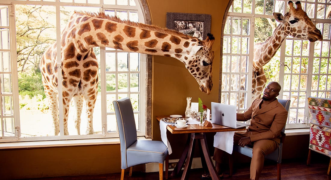 Giraffe Sanctuary Restaurant in Africa Man Sitting at Table Portrait