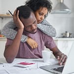 Black married couple dealing with financial stress.