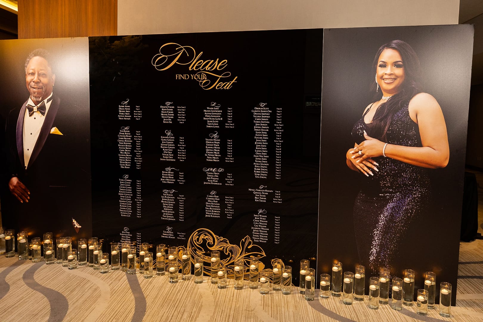 Black and Gold Seating Chart with Floating Candle Wedding Decor and Portraits of the Couple