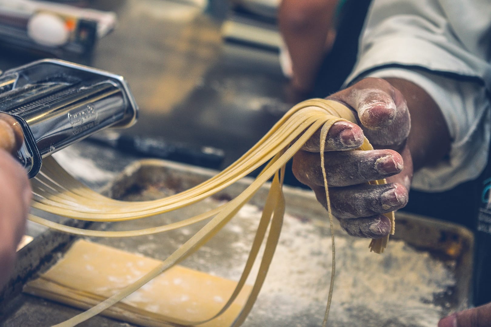 Pasta making in Tuscany, Italy during a destination wedding