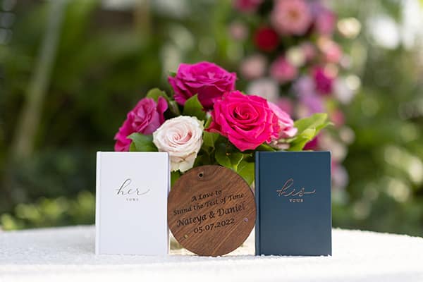 His and Hers Vow Books in White and Navy with Hot Pink Roses