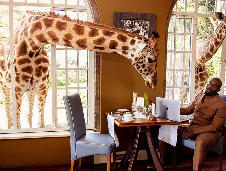 Giraffe Sanctuary Restaurant in Africa Man Sitting at Table Portrait