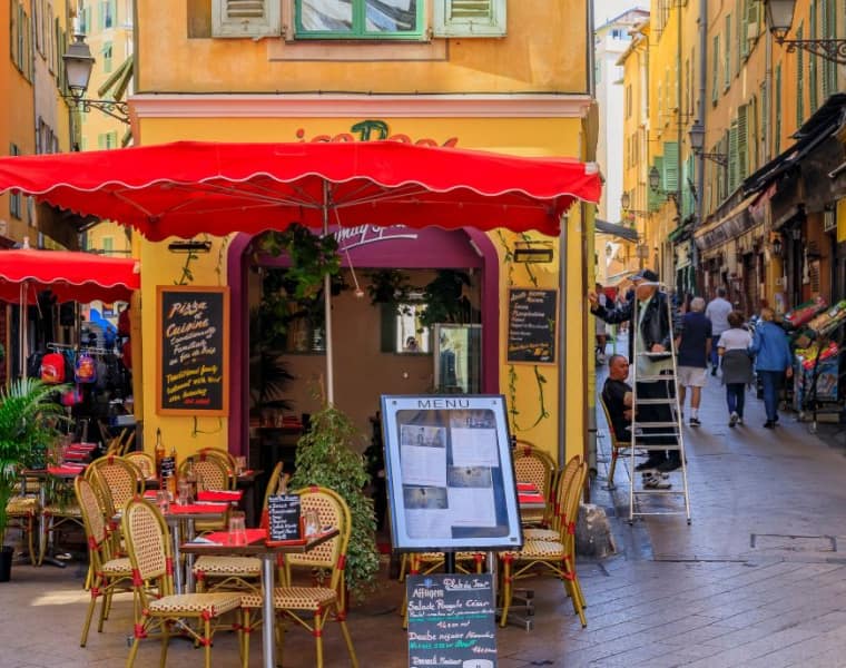 The pedestrian zone, commercial and cultural landmark with restaurants and shops in traditional houses in the French Riviera