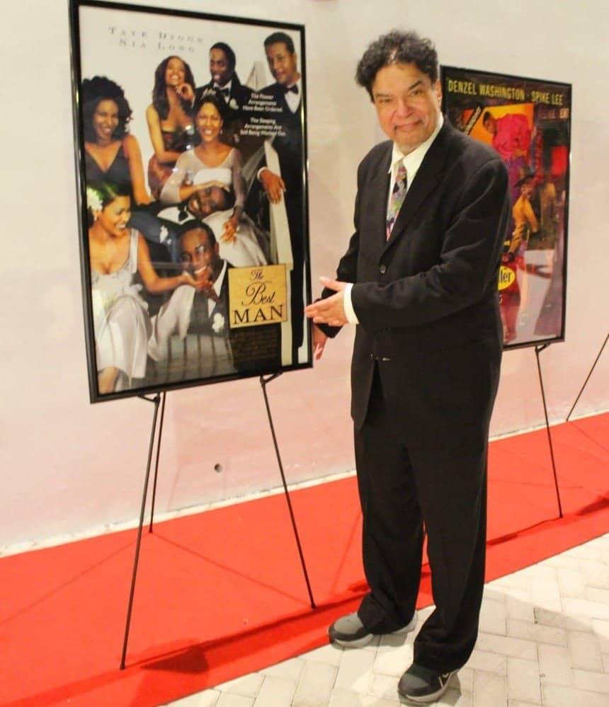 Artist Art Sims at his poster "The Best Man" at The Art of Love event during Art Basel Miami 2023. 