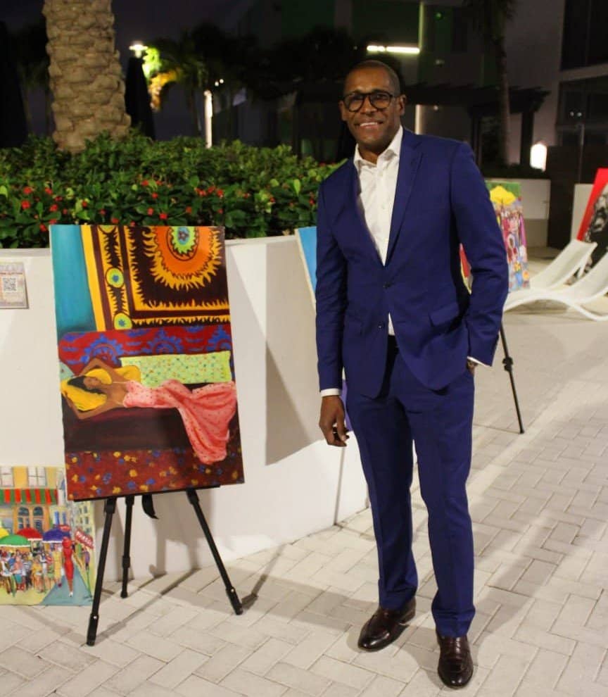 Artist Alvin Clayton-Fernandes stands alongside one of his pieces at the Art of Love event held on December 8, 2023 in Miami Beach. 