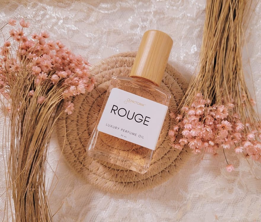 Olfactorini's Rouge fragrance blends velvety soft rose with clean, sweet oud, creating a symphony of scents that is both alluring and sophisticated