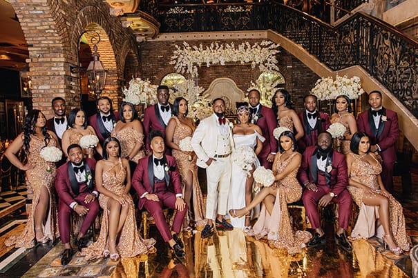Burgundy Groomsmen Tuxedos | Glittery Gold Bridesmaids Dresses | Glamorous Wedding Party Portrait | Photographer Stanlo Photography