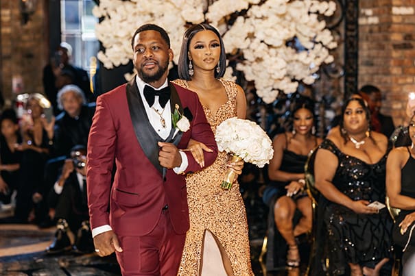 Groomsmen and Bridesmaid Walking down the Aisle in Burgundy Tux and Gold Glittery Bridesmaids Dress Wedding Portrait | Wedding Photographer Stanlo Photography