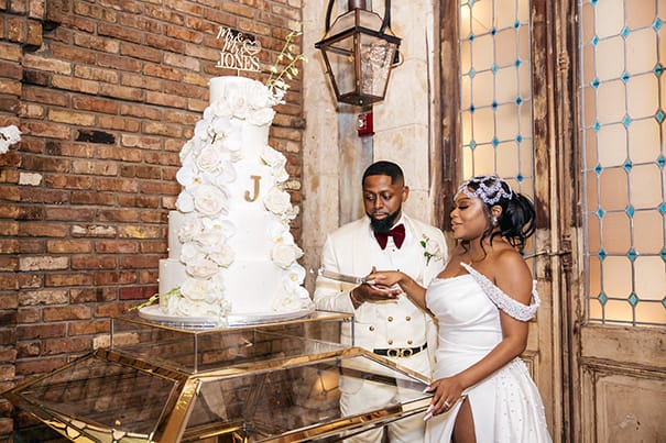 Five Tier White Wedding Cake with White Florals and Gold Detailing and Cake Topper Wedding Portrait | Wedding Photographer Stanlo Photography